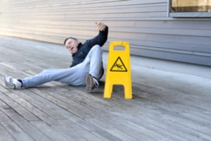 Wet floor sign and person slipping